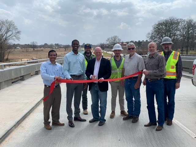 Fort Bend County Commissioner Andy Meyers (center with scissors) cuts the ribbon to open Cane Island Parkway in February of this year. Meyers has been an advocate for mobility improvements in the Cinco Ranch area which makes up a large portion of his precinct. He announced Aug. 16 that Texas Heritage Parkway, a multi-agency project, is expected to open Aug. 20.